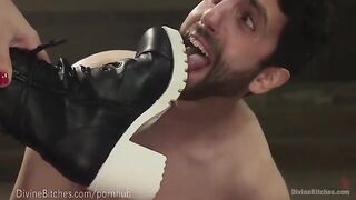 The muscled dominatrix is superior in wrestling with her slaveboy