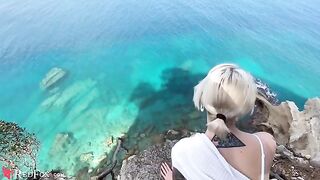 A cute girlfriend passionately sucks her ex-boyfriend's big dick on the shore