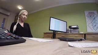 A woman entrepreneur needs money, so she turns to a loan agent for help
