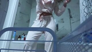 The girl caresses her pussy in the bathroom, feeling no shame