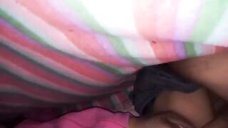 A big ass Latina woman having fun under the sheets