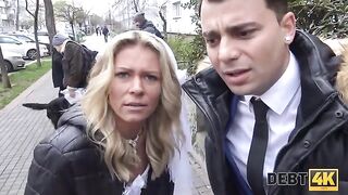 The blonde is getting fucked by a collector in front of her husband