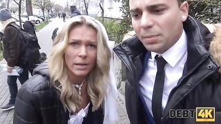 The blonde is getting fucked by a collector in front of her husband