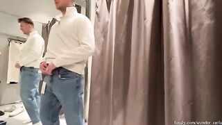 A hot chick is fucking with a stranger in the fitting room of a shopping mall