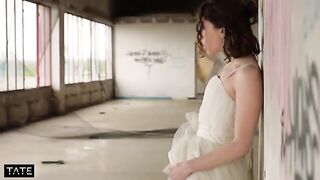 A stranger pushed a girl in the dress in the risque spot