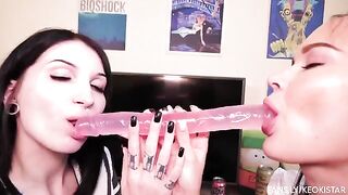 Two lesbian babes play with their juicy pussies using a double-ended dildo