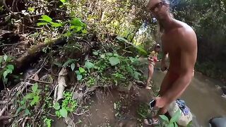A couple has sex on the riverbank in the jungle area
