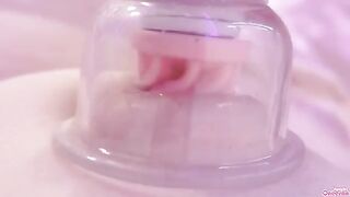 A girl plays with her nipples and clit using a toy to reach orgasm