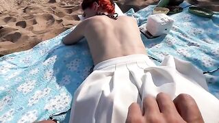 A couple engaged in rough sex on the public beach, inspired by raw passion