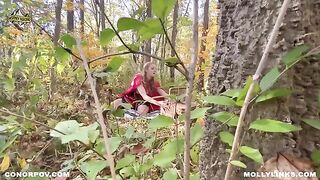 A sexy girl in a red cloak is fucking with a big bad wolf outdoors