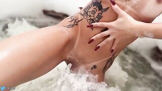 A gorgeous girl is having fun in the hotel pool, getting wild