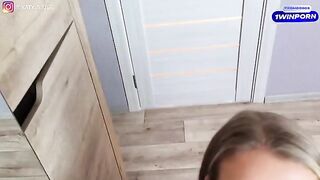 A pretty woman is trying on sexy lingerie and having fun with it