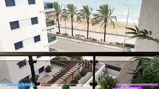 A couple engaged in sex on the balcony, right by the sea