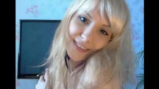 Blonde with small boobs plays with her pussy