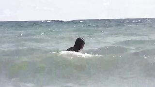 Nude girls are basking in the sun on the beach