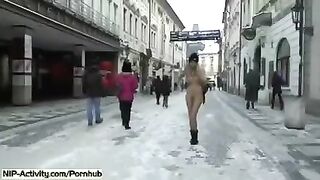 Blonde student caresses her boobs and cunny on the city streets