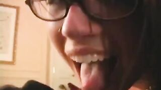 The fool is happy in glasses, getting a dick in his mouth