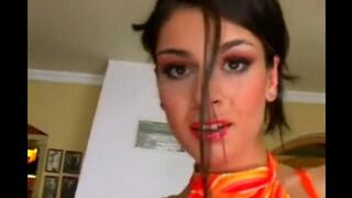 Brunette masturbating her pussy on a leather chair with a powerful vibrator