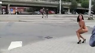 A hot brunette with a great figure exposes herself in public for money