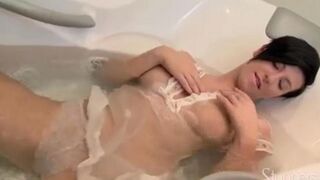 A lonely pregnant brunette rubs her pussy on the couch