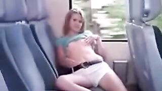 Lifting the skirt on the bus and ironing her pussy through panties