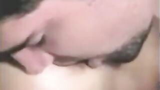 The guy was fucking a strapon, while another girl was fingering his dick with her hand