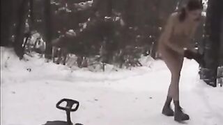 Nude girls play snowballs on the street during the winter