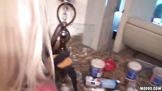 A young couple have fun at their home, getting playful