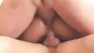 A man cheats on his wife with other women on the couch in an intense threesome