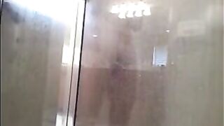 The guy washes in the shower, but he does not know that he is being filmed