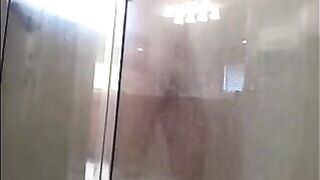 The guy washes in the shower, but he does not know that he is being filmed