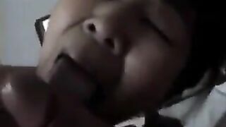 The Chinese woman practices her blowjob skills on her man in a steamy bedroom session