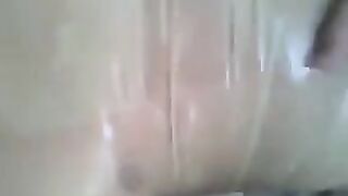 A man put a condom on his penis and masturbated with his hand