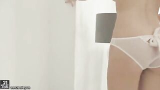 Skinny blonde girl masturbates her hairy pussy with her fingers