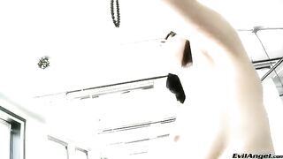 A cute girl plays with a ball and masturbates in high heels