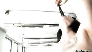 A cute girl plays with a ball and masturbates in high heels