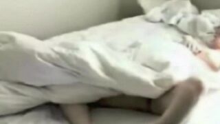 Someone masturbates while unaware of a hidden camera in the bedroom