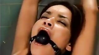 Girl gets fucked by a bald man using a sex machine in a hardcore scene