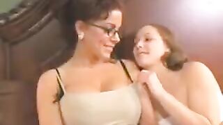 A mother makes lesbian love with her daughter on the bed