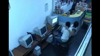 A young man masturbates his cock in the internet cafe