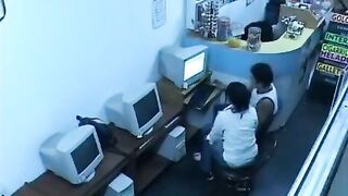A young man masturbates his cock in the internet cafe