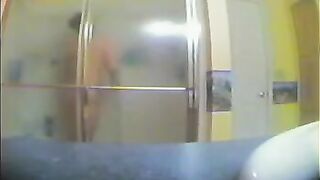 A girl has no idea that someone is watching her in the shower