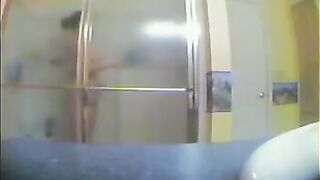 A girl has no idea that someone is watching her in the shower