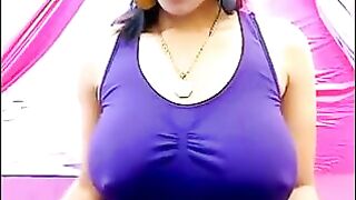 The nipples of the excited brunette stick out through her T-shirt