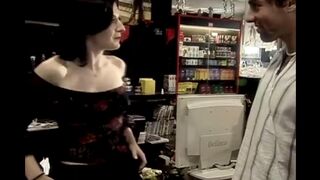 The girl is having fun with a client in her role as a saleswoman