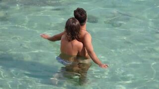 Girl masturbating the dick of a guy underwater in the sea