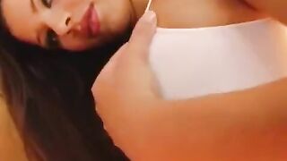 The girl caresses her big and wet vagina with a dildo