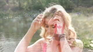 A hot blonde has a tender sex with herself on the lake