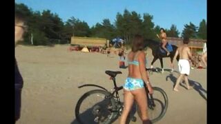 Nudist girl has sex with her lover on the beach, enjoying the wild freedom of public exposure