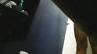 A girl washes herself in the shower, not suspecting a hidden camera